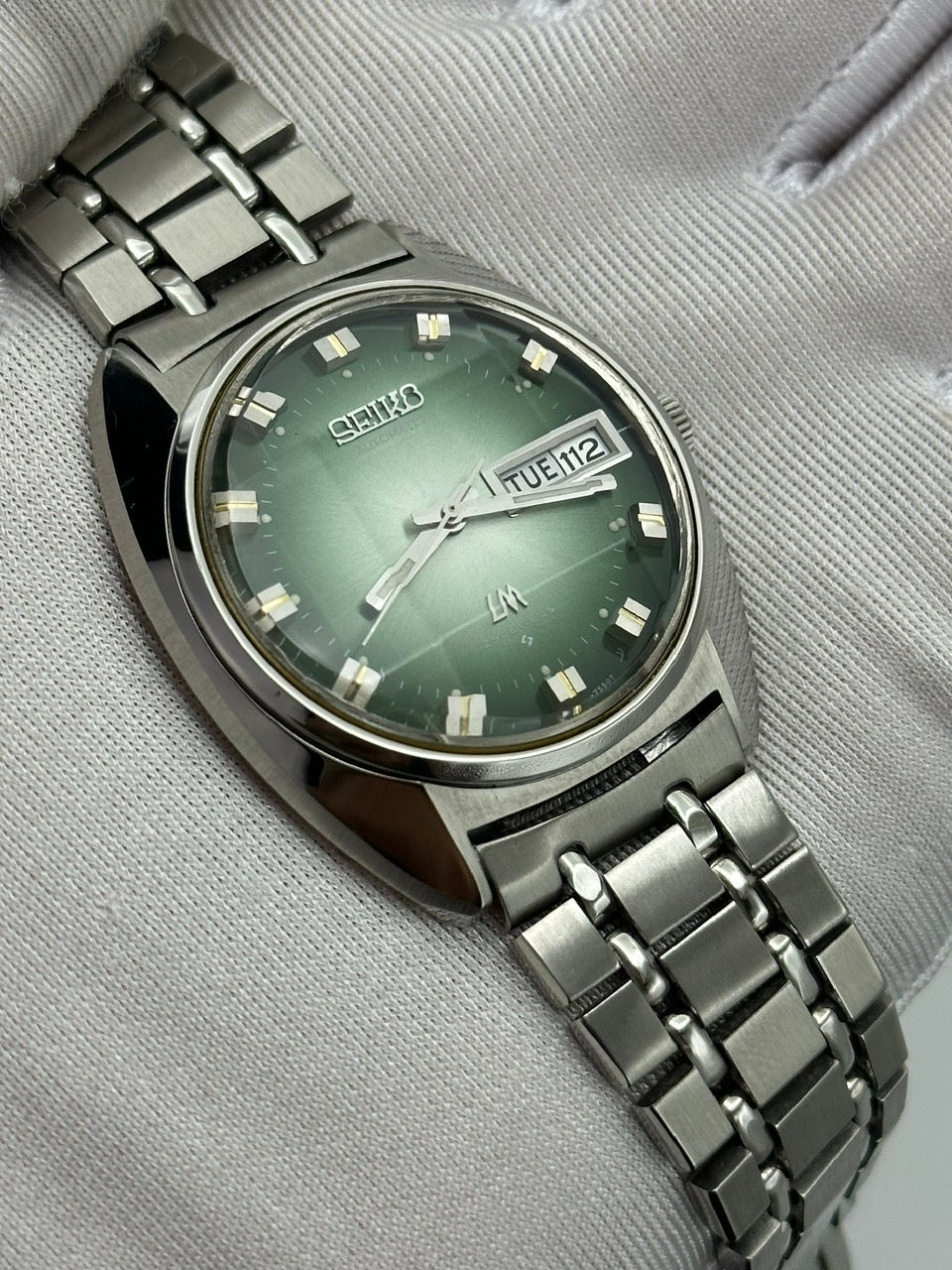 SEIKO LORD MATIC LM DAY-DATE FACETED CRYSTAL GREEN DIAL AUTOMATIC REF. 5606-7230